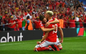 Aaron Ramsey (R) of Wales celebrates scoring his team's first goal with his team mate James Chester (L) during the UEFA EURO 2016 Group B match