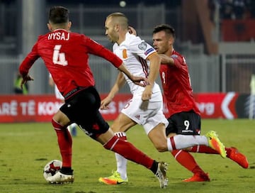 Andrés Iniesta (centre) looks to break through Albania's dogged backline in Shkodër.