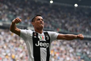 Juventus' Portuguese forward Cristiano Ronaldo celebrates after he scored his first goal since he joined Juventus during the Italian Serie A football match Juventus vs Sassuolo on September 16, 2018 at the Juventus stadium in Turin.