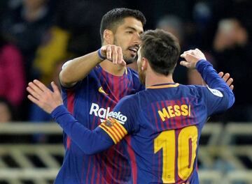 A dream realised | Barcelona’s Luis Suarez celebrates with Lionel Messi.