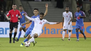 India's forward Sunil Chhetri (L) fights for the ball with Bahrain's midfielder Ali Madan during the 2019 AFC Asian Cup group A football match between India and Bahrain at the Sharjah Stadium in Sharjah on January 14, 2019. (Photo by Karim Sahib