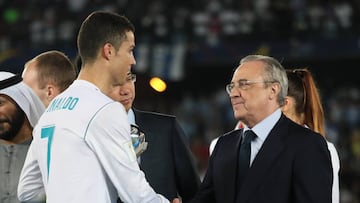 Cristiano Ronaldo of Real Madrid shakes hands with Real Madrid President Florentino Perez at the end of the FIFA Club World Cup UAE 2017 final