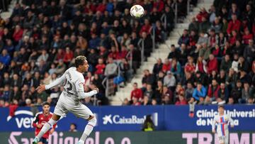 Barcelona's Brazilian forward Raphinha heads the ball and scores a goal during the Spanish league football match between CA Osasuna and FC Barcelona at El Sadar stadium in Pamplona on November 8, 2022. (Photo by CESAR MANSO / AFP)