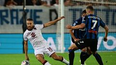 Torino's Croatian midfielder Nikola Vlasic (L) fights for the ball with Atalanta's Dutch midfielder Teun Koopmeiners during the Italian Serie A football match between Atalanta and Torino at The Atleti Azzurri d'Italia Stadium in Bergamo on September 1, 2022. (Photo by MIGUEL MEDINA / AFP)