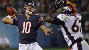CHICAGO, IL - AUGUST 10: Mitchell Trubisky #10 of the Chicago Bears passes under pressure from Shakir Soto #67 of the Denver Broncos during a preseason game at Soldier Field on August 10, 2017 in Chicago, Illinois. The Broncos defeated the Bears 24-17. Jonathan Daniel/Getty Images/AFP
== FOR NEWSPAPERS, INTERNET, TELCOS & TELEVISION USE ONLY ==