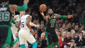 Dec 23, 2018; Boston, MA, USA; Boston Celtics guard Kyrie Irving (11) stretches for a loose ball during the first half against the Charlotte Hornets at TD Garden. Mandatory Credit: Bob DeChiara-USA TODAY Sports