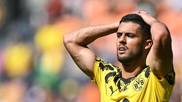 Borussia Dortmund's Brazilian defender #02 Yan Couto reacts after missing a goal opportunity during the FIFA Club World Cup 2025 Group F football match between Germany's Borussia Dortmund and South Korea's Ulsan HD at the TQL stadium in Cincinnati on June 25, 2025. (Photo by Paul ELLIS / AFP)