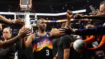 PHOENIX, ARIZONA - APRIL 17: Chris Paul #3 of the Phoenix Suns high fives fans as he walks off the court following game one of the Western Conference First Round NBA Playoffs against the New Orleans Pelicans at Footprint Center on April 17, 2022 in Phoenix, Arizona. The Suns defeated the Pelicans 110-109. NOTE TO USER: User expressly acknowledges and agrees that, by downloading and or using this photograph, User is consenting to the terms and conditions of the Getty Images License Agreement. Christian Petersen/Getty Images/AFP
== FOR NEWSPAPERS, INTERNET, TELCOS & TELEVISION USE ONLY ==