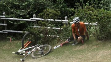Mathieu van der Poel of the Netherlands gets up after crashing on a downhill during the men's cross country mountain bike competition at the 2020 Summer Olympics, Monday, July 26, 2021, in Izu, Japan. (AP Photo/Thibault Camus)