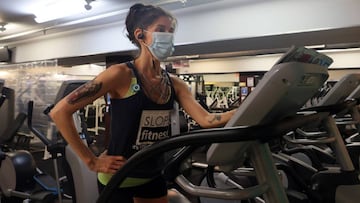 NEW YORK, NEW YORK - SEPTEMBER 02: Stacy Rollins uses an elliptical machine at Slope Fitness on September 02, 2020 in New York City. Indoor gyms in New York City reopened today after being closed for five months due to the coronavirus (COVID-19) pandemic.