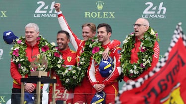(From L) Ferrari Indurance program manager Antonello Coletta, Ferrari 499P Hybrid Hypercar WEC's Italian driver Antonio Fuoco, Danish driver Nicklas Nielsen and Spanish driver Miguel Molina (R) and Ferrari's Head of Endurance Cars Ferdinado Cannizzo listen to the Italian national anthem on the podium after winning the Le Mans 24-hours endurance race in Le Mans, western France, on June 16, 2024. Ferrari won a wild and wet 92nd edition of the Le Mans 24 Hours race on June 16, 2024, as Nicklas Nielsen took the chequered flag after a vintage and gruelling race, the Dane sharing driving duties in the Italian constructor's No 50 car with Italian Antonio Fuoco and Spaniard Miguel Molina. (Photo by FRED TANNEAU / AFP)