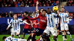 Osasuna's Colombian defender #22 Johan Mojica fights for the ball with Real Sociedad's Nigerian forward #19 Umar Sadiq during the Spanish league football match between CA Osasuna and Real Sociedad at El Sadar stadium in Pamplona on December 2, 2023. (Photo by ANDER GILLENEA / AFP)