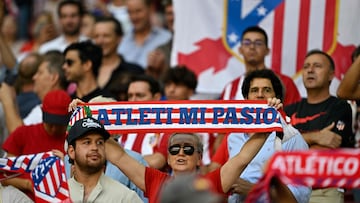 Atletico Madrid's supporters wave scarves before the start of the UEFA Champions League 1st round day 2 group E football match between Club Atletico de Madrid and Feyenoord at the Wanda Metropolitano stadium in Madrid on October 4, 2023. (Photo by JAVIER SORIANO / AFP)