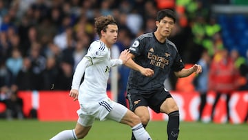 Leeds United's US midfielder Brenden Aaronson (L) vies with Arsenal's Japanese defender Takehiro Tomiyasu (R) during the English Premier League football match between Leeds United and Arsenal at Elland Road in Leeds, northern England on October 16, 2022. (Photo by Lindsey Parnaby / AFP) / RESTRICTED TO EDITORIAL USE. No use with unauthorized audio, video, data, fixture lists, club/league logos or 'live' services. Online in-match use limited to 120 images. An additional 40 images may be used in extra time. No video emulation. Social media in-match use limited to 120 images. An additional 40 images may be used in extra time. No use in betting publications, games or single club/league/player publications. / 