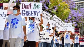 Advocates and supporters of the AIDS Healthcare Foundation call for the United States to share the Covid-19 vaccine during a rally in Los Angeles, California on June 10, 2021.