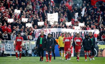 VFB Stuttgart's Benjamin Pavard, Borna Sosa and Alexander Esswein look dejected after the match