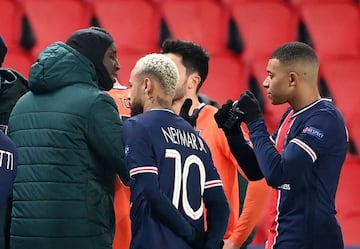 Istanbul Basaksehir's French forward Demba speaks to Paris Saint-Germain's French forward Kylian Mbappe during the UEFA Champions League group H football match between Paris Saint-Germain (PSG) and Istanbul Basaksehir FK at the Parc des Princes stadium in