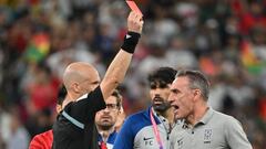 South Korea's Portuguese coach Paulo Bento (R) is given a red card by English referee Anthony Taylor during the Qatar 2022 World Cup Group H football match between South Korea and Ghana at the Education City Stadium in Al-Rayyan, west of Doha, on November 28, 2022. (Photo by JUNG Yeon-je / AFP) (Photo by JUNG YEON-JE/AFP via Getty Images)