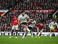 Fulham's Mexican striker #07 Raul Jimenez (front L) scores on a penalty kick for the team's first goal during the English Premier League football match between Manchester United and Fulham at Old Trafford in Manchester, north west England, on February 1, 2026. (Photo by Paul ELLIS / AFP) / RESTRICTED TO EDITORIAL USE. No use with unauthorized audio, video, data, fixture lists, club/league logos or 'live' services. Online in-match use limited to 120 images. An additional 40 images may be used in extra time. No video emulation. Social media in-match use limited to 120 images. An additional 40 images may be used in extra time. No use in betting publications, games or single club/league/player publications. /