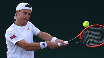 Argentina's Diego Schwartzman returns the ball to Serbia's Miomir Kecmanovic during their men's singles tennis match on the first day of the 2023 Wimbledon Championships at The All England Tennis Club in Wimbledon, southwest London, on July 3, 2023. (Photo by Adrian DENNIS / AFP) / RESTRICTED TO EDITORIAL USE