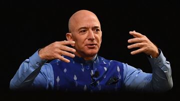 (FILES) In this file photo the CEO of Amazon Jeff Bezos (R) gestures as he addresses the Amazon&#039;s annual Smbhav event in New Delhi on January 15, 2020. - As he prepares to blast off into a new career stage, Jeff Bezos leaves an enduring legacy after 