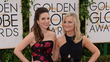 (FILES) In this file photo taken on February 01, 2021 this January 12, 2014 photo shows actress Tina Fey (L) and Amy Poehler (R) arriving for the 71st Golden Globe Awards held at the Beverly Hilton hotel in Beverly Hills. - Hollywood's awards season