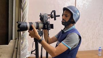 Reuters' Palestinian journalist Mohammed Salem, who welcomed his newborn Abdallah while covering Israeli bombardment in Gaza, poses for a photo in Gaza City