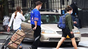 NEW YORK, NEW YORK - OCTOBER 19: A man pulls a cart filled with groceries on October 19, 2020 in New York City. A ban on plastic bags in New York began to be enforced today after being delayed amid the coronavirus (COVID-19) pandemic.   Michael M. Santiag