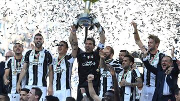 TURIN, ITALY - MAY 21: Gianluigi Buffon of Juventus FC celebrates with the trophy after the beating FC Crotone 3-0 to win the Serie A Championships at the end of the Serie A match between Juventus FC and FC Crotone at Juventus Stadium on May 21, 2017 in Turin, Italy. (Photo by Valerio Pennicino/Getty Images)
