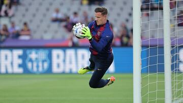 Barcelona's German goalkeeper #01 Marc-Andre ter Stegen warms up prior the Spanish league football match between FC Barcelona and Real Sociedad at the Estadi Olimpic Lluis Companys in Barcelona on May 13, 2024. (Photo by LLUIS GENE / AFP)