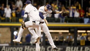 MILWAUKEE, WI - OCTOBER 19: Orlando Arcia #3 and Ryan Braun #8 of the Milwaukee Brewers celebrate after defeating the Los Angeles Dodgers in Game Six of the National League Championship Series at Miller Park on October 19, 2018 in Milwaukee, Wisconsin.   