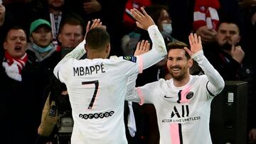 Paris Saint-Germain's Argentinian forward Lionel Messi (R) is congratulated by Paris Saint-Germain's French forward Kylian Mbappe (L) after scoring a goal during the French L1 football match between Lille and Paris Saint-Germain at the Pierre-Ma