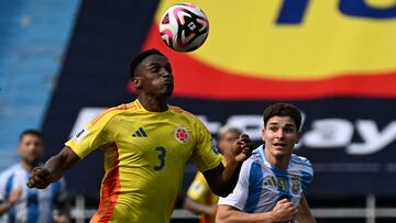 Colombia's defender Jhon Lucumi (L) and Argentina's forward Julian Alvarez fight for the ball during the 2026 FIFA World Cup South American qualifiers football match between Colombia and Argentina, at the Metropolitano Roberto Mel�ndez stadium in Barranquilla, Colombia, on September 10, 2024. (Photo by JOAQUIN SARMIENTO / AFP)