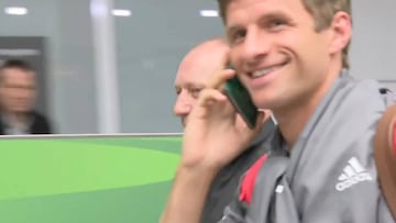 Müller pretends passport is a phone to avoid prowling press