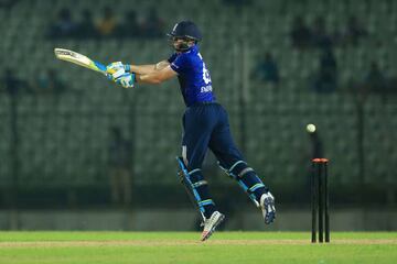 Jos Buttler plays a shot plays a shot during the warm-up cricket match between a BCB XI and England.