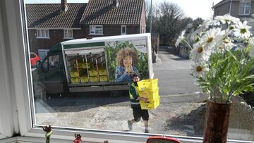 ***BESTPIX*** WEYMOUTH, ENGLAND - MARCH 27: Morrisons supermarket delivery van delivers to a house on March 27, 2020 in Weymouth, United Kingdom. The UK's supermarkets have been struggling to keep up with the high demand of online delivery orders. St