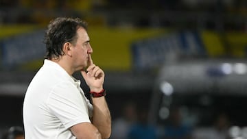 Colombia's Argentine head coach Nestor Lorenzo gestures during the 2026 FIFA World Cup South American qualifiers football match between Colombia and Paraguay at the Metropolitano Roberto Melendez stadium in Barranquilla, Colombia, on March 25, 2025. (Photo by Luis ACOSTA / AFP)