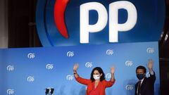 Madrid regional president and People&#039;s Party (PP) candidate Isabel Diaz Ayuso (L) and PP leader Pablo Casado wave to supporters at the People&#039;s Party (PP) headquarters in Madrid after the Madrid regional elections on May 4, 2021. - Spain&#039;s 