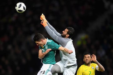 Alisson punches clear