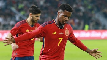 Spain's forward Ansu Fati (R) celebrates scoring during the friendly football match between Jordan and Spain, at the Hussein Youth City stadium, in the Jordanian capital Amman on November 17, 2022. (Photo by Khalil MAZRAAWI / AFP)