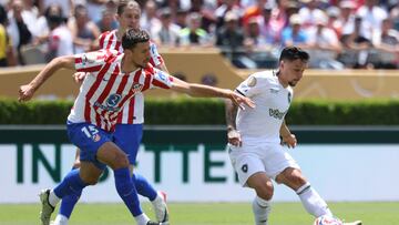 Atletico Madrid's French defender #15 Clement Lenglet and Botafogo's Brazilian forward #07 Artur fight for the ball during the FIFA Club World Cup 2025 Group B football match between Spain's Atletico de Madrid and Brazil's Botafogo at the Rose Bowl stadium in Los Angeles on June 23, 2025. (Photo by Patrick T. Fallon / AFP)