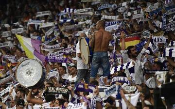 A Real Madrid's fan plays with a drum during the UEFA Champions League football match Real Madrid CF vs APOEL FC at the Santiago Bernabeu stadium in Madrid on September 13, 2017.