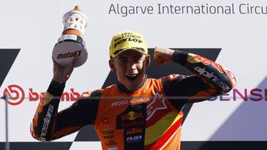 MotoGP - Algarve Grand Prix - The Algarve International Circuit, Portimao, Portugal - November 7, 2021 Red Bull KTM Ajo's Pedro Acosta celebrates with trophy on the podium winning the race and the Moto3 world championship REUTERS/Marcelo Del Pozo