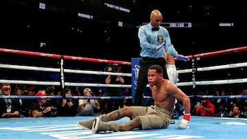 NEW YORK, NEW YORK - APRIL 20: Devin Haney (gray trunks) reacts after being knocked down by Ryan Garcia (white trunks) during their WBC Super Lightweight title bout at Barclays Center on April 20, 2024 in New York City.   Al Bello/Getty Images/AFP (Photo by AL BELLO / GETTY IMAGES NORTH AMERICA / Getty Images via AFP)