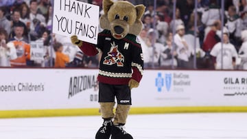 TEMPE, ARIZONA - APRIL 17: The Arizona Coyotes mascot, "Howler" holds up a sign reading "thank you fans" following the NHL game against the Edmonton Oilers at Mullett Arena on April 17, 2024 in Tempe, Arizona. Tonight's game likely marks the end of 28 years for the franchise, playing in the NHL's smallest arena, with an anticipated move to Utah with the team's expected sale to the NBA's Utah Jazz owner Ryan Smith.   Christian Petersen/Getty Images/AFP (Photo by Christian Petersen / GETTY IMAGES NORTH AMERICA / Getty Images via AFP)