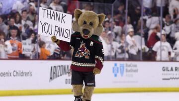 TEMPE, ARIZONA - APRIL 17: The Arizona Coyotes mascot, "Howler" holds up a sign reading "thank you fans" following the NHL game against the Edmonton Oilers at Mullett Arena on April 17, 2024 in Tempe, Arizona. Tonight's game likely marks the end of 28 years for the franchise, playing in the NHL's smallest arena, with an anticipated move to Utah with the team's expected sale to the NBA's Utah Jazz owner Ryan Smith.   Christian Petersen/Getty Images/AFP (Photo by Christian Petersen / GETTY IMAGES NORTH AMERICA / Getty Images via AFP)