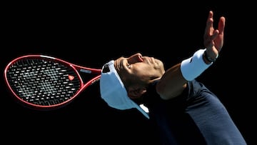 Chile's Alejandro Tabilo serves to France's Quentin Halys during their men's singles match on day two of the Australian Open tennis tournament in Melbourne on January 19, 2026. (Photo by DAVID GRAY / AFP) / -- IMAGE RESTRICTED TO EDITORIAL USE - STRICTLY NO COMMERCIAL USE --