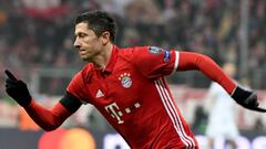 Robert Lewandowski celebrates scoring the opening goal during the UEFA Champions League group D football match between FC Bayern Munich and Atletico Madrid