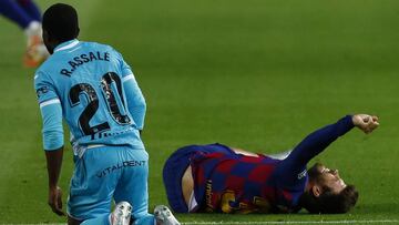 FC Barcelona's Gerard Pique grimaces injured during the Spanish La Liga soccer match between FC Barcelona and Leganes at the Camp Nou stadium in Barcelona, Spain, Tuesday, June 16, 2020. (AP Photo/Joan Montfort)