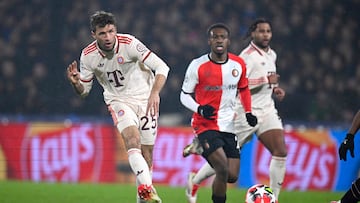 Bayern Munich's German forward #25 Thomas Mueller (L) kicks the ball during the UEFA Champions League, league phase day 7, football match between Feyenoord (NED) and FC Bayern Munich (GER) at the Feyenoord Stadium in Rotterdam, on January 22, 2025. (Photo by JOHN THYS / AFP)